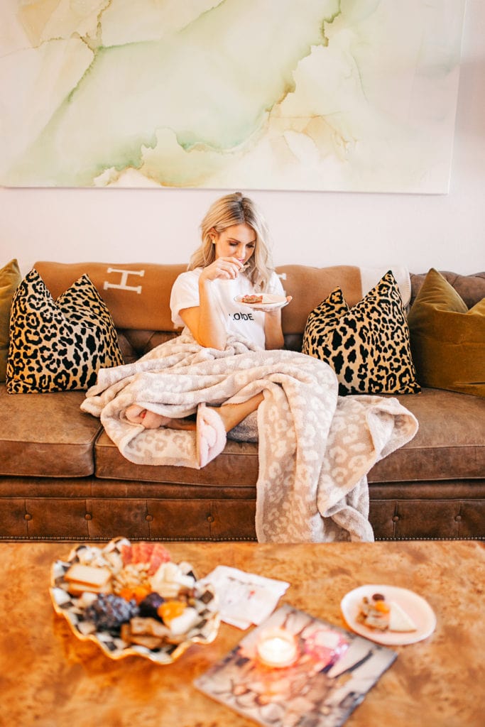 girl eating cheese board from Trader Joe's