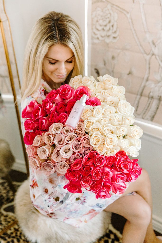 Blonde Girl Smelling Roses