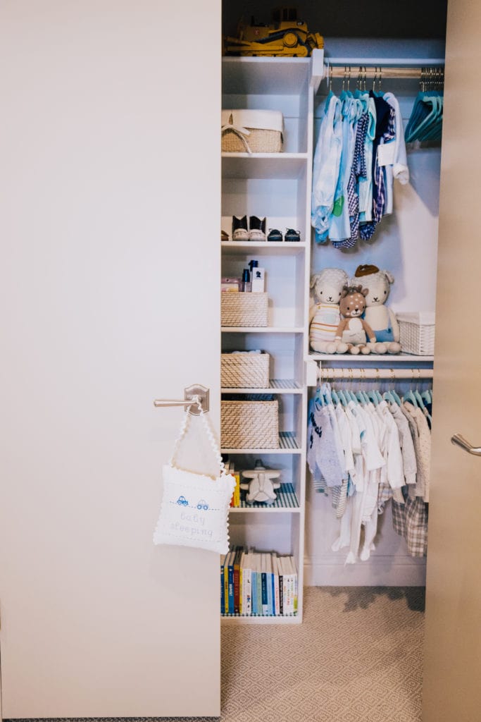 Using baby clothes hangers to organise a baby wardrobe